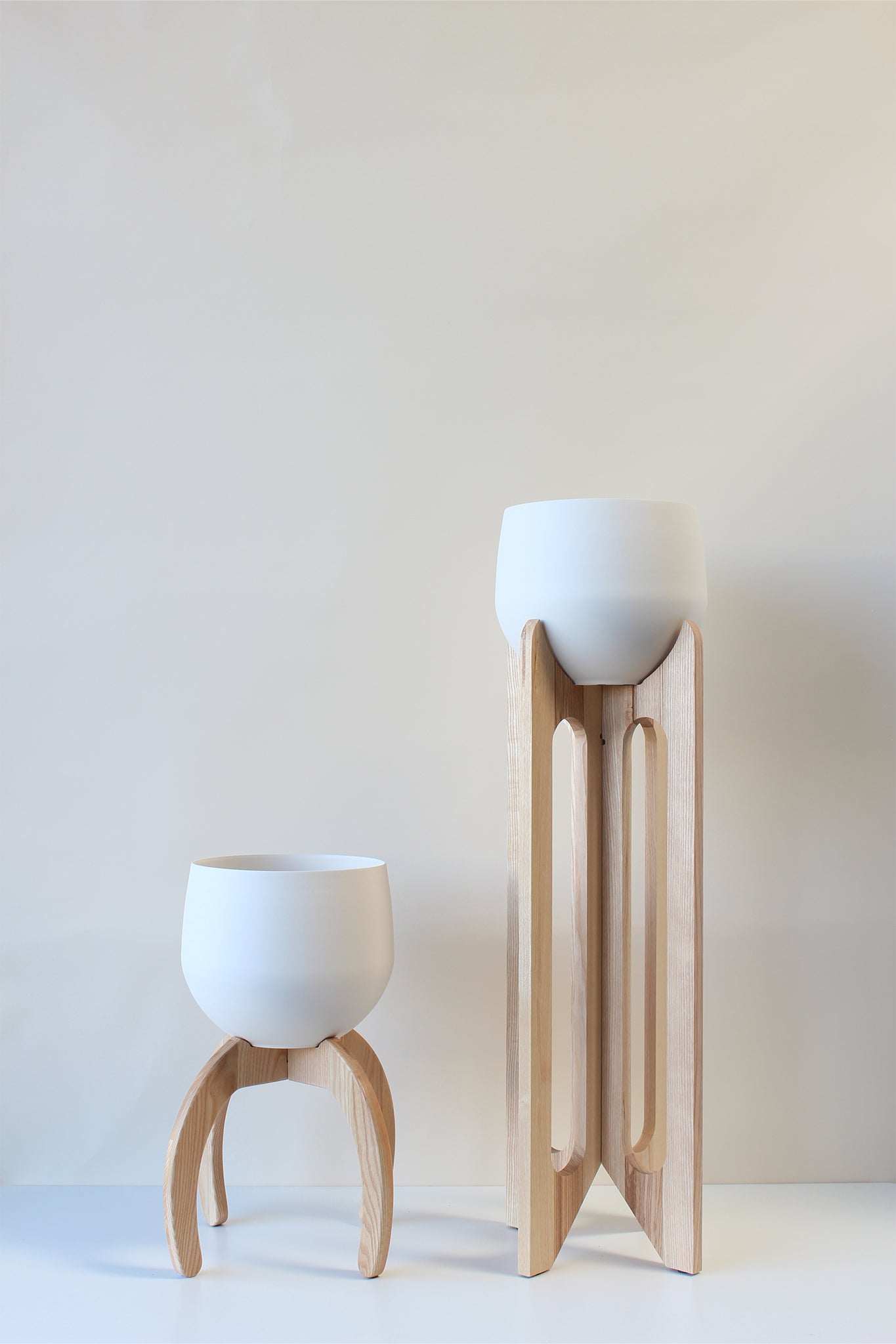 modern white ash plant stand with spun aluminum white pots