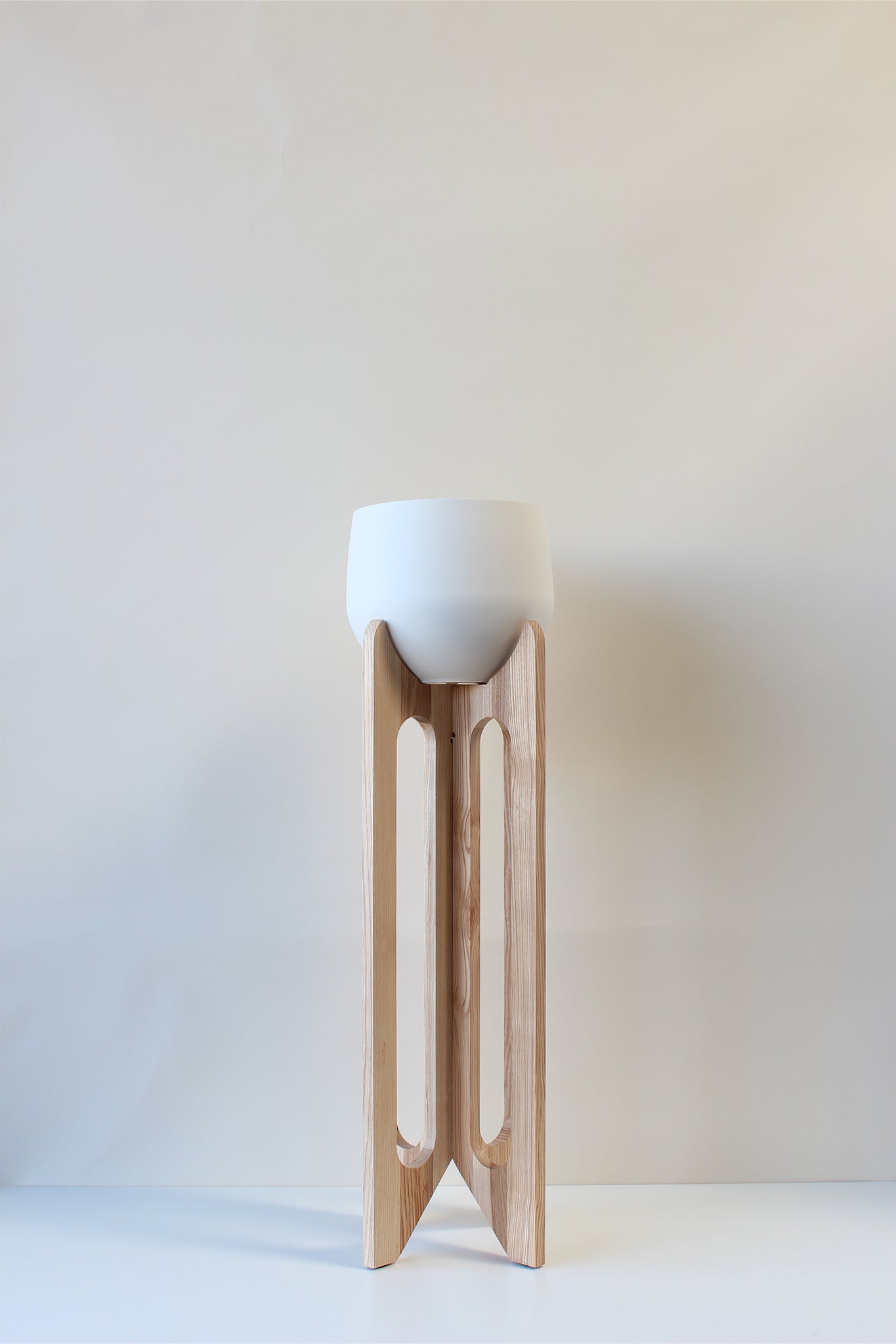 tall modern plant stand with white aluminum pot