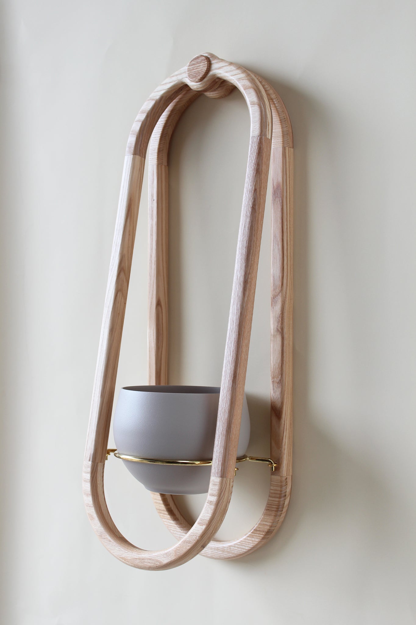 modern scandi inspired obround wall mounted planter with sand colored pot