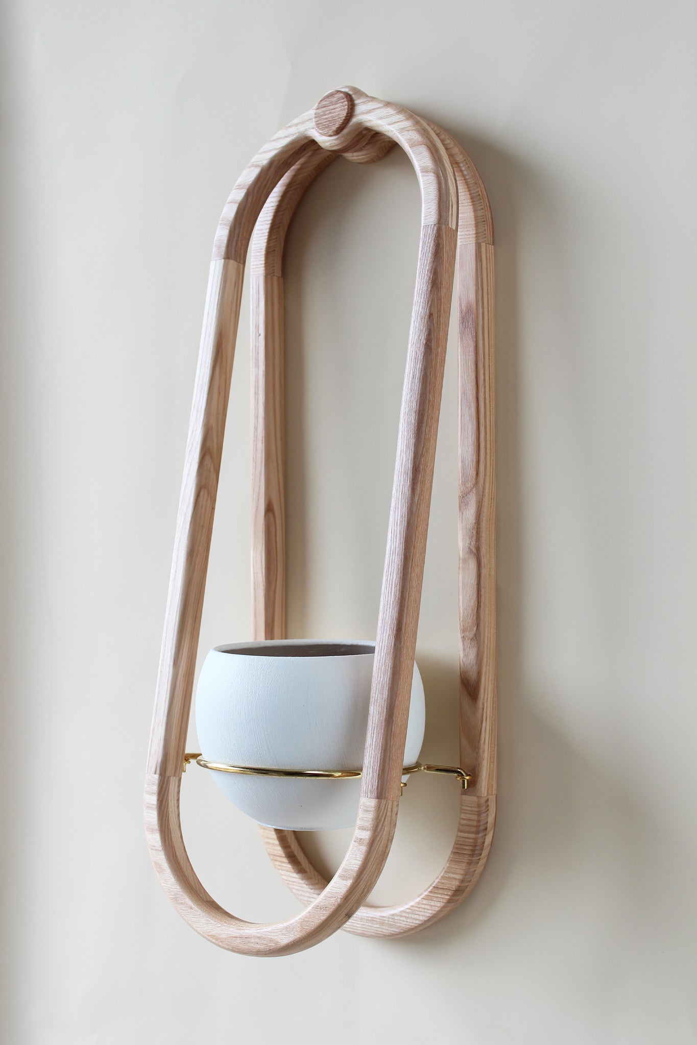 modern scandi inspired obround wall mounted planter with white colored pot