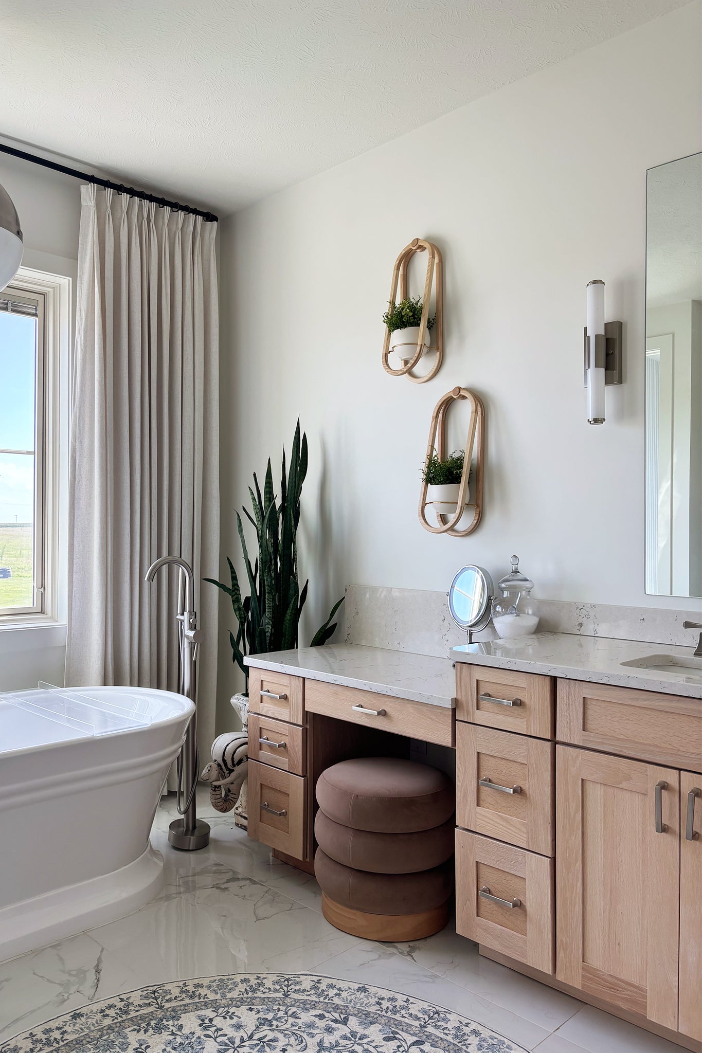 Modern bathroom with freestanding bathtub, vanity, and the Frame Wall Planter Duo on the wall above the counter.