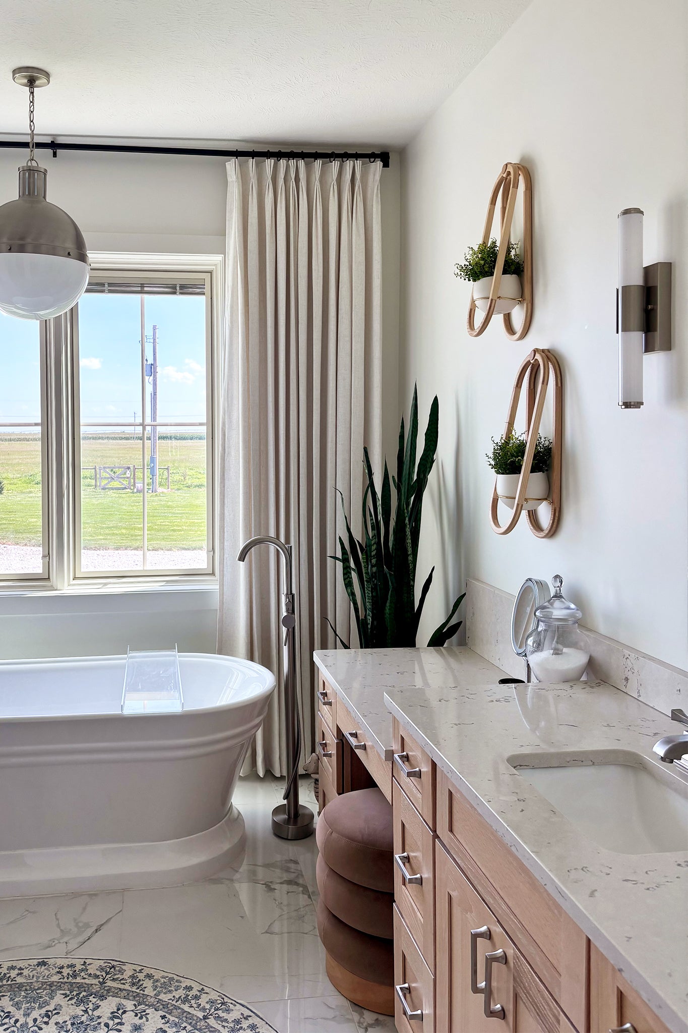 Modern bathroom with freestanding bathtub, vanity, and the Frame Wall Planter Duo on the wall above the counter.