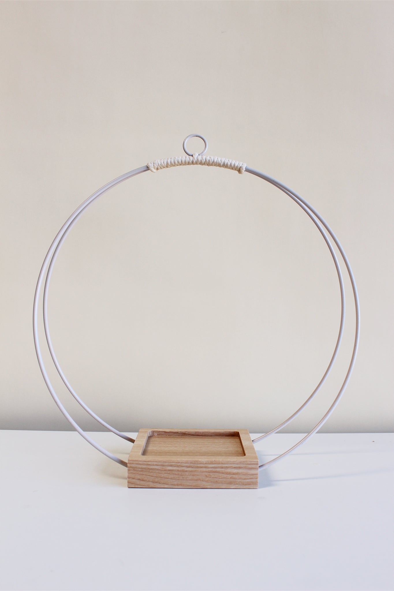 large white circular plant hanger with no pot