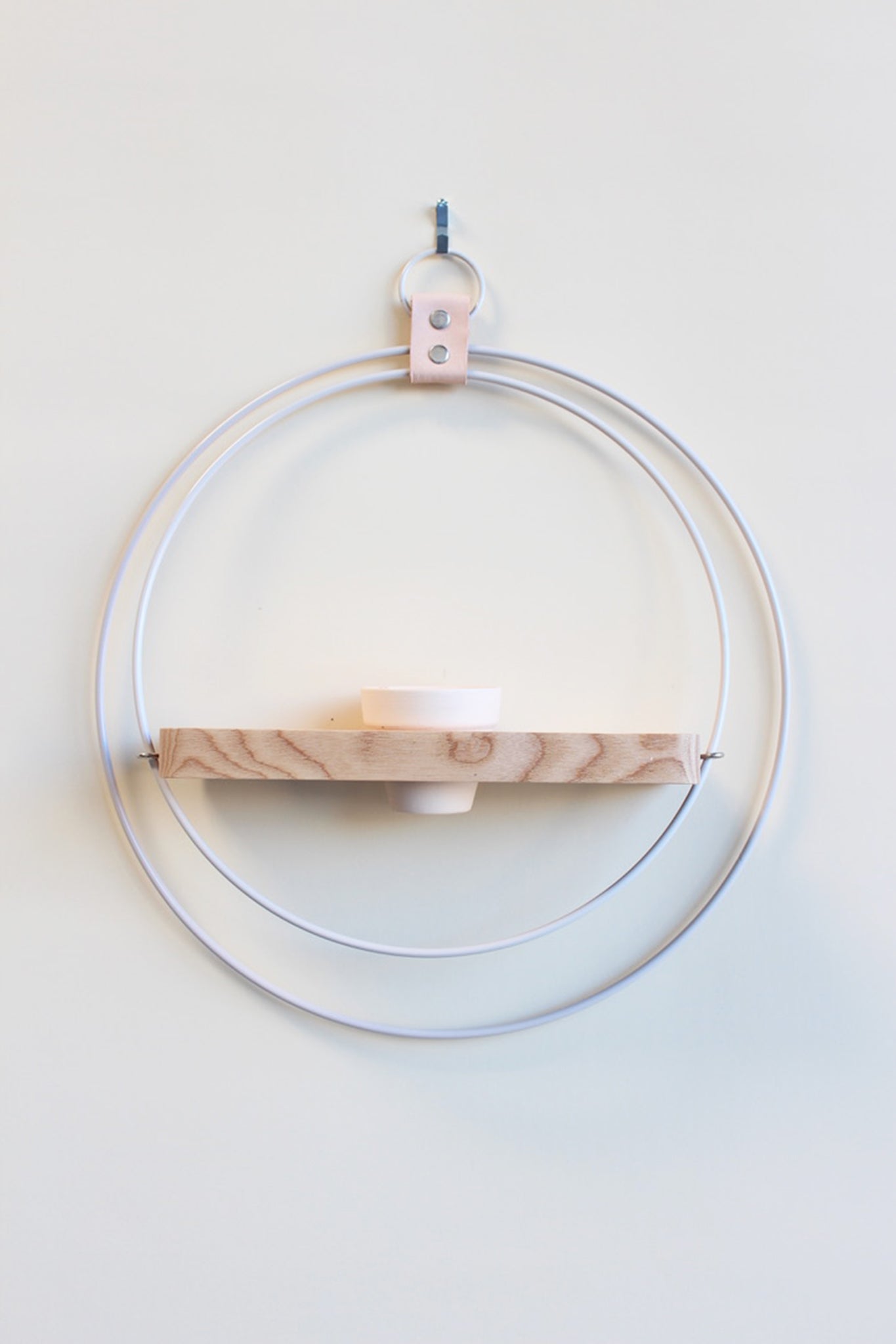 white and light wood circular wall mounted hanging planter for air plants
