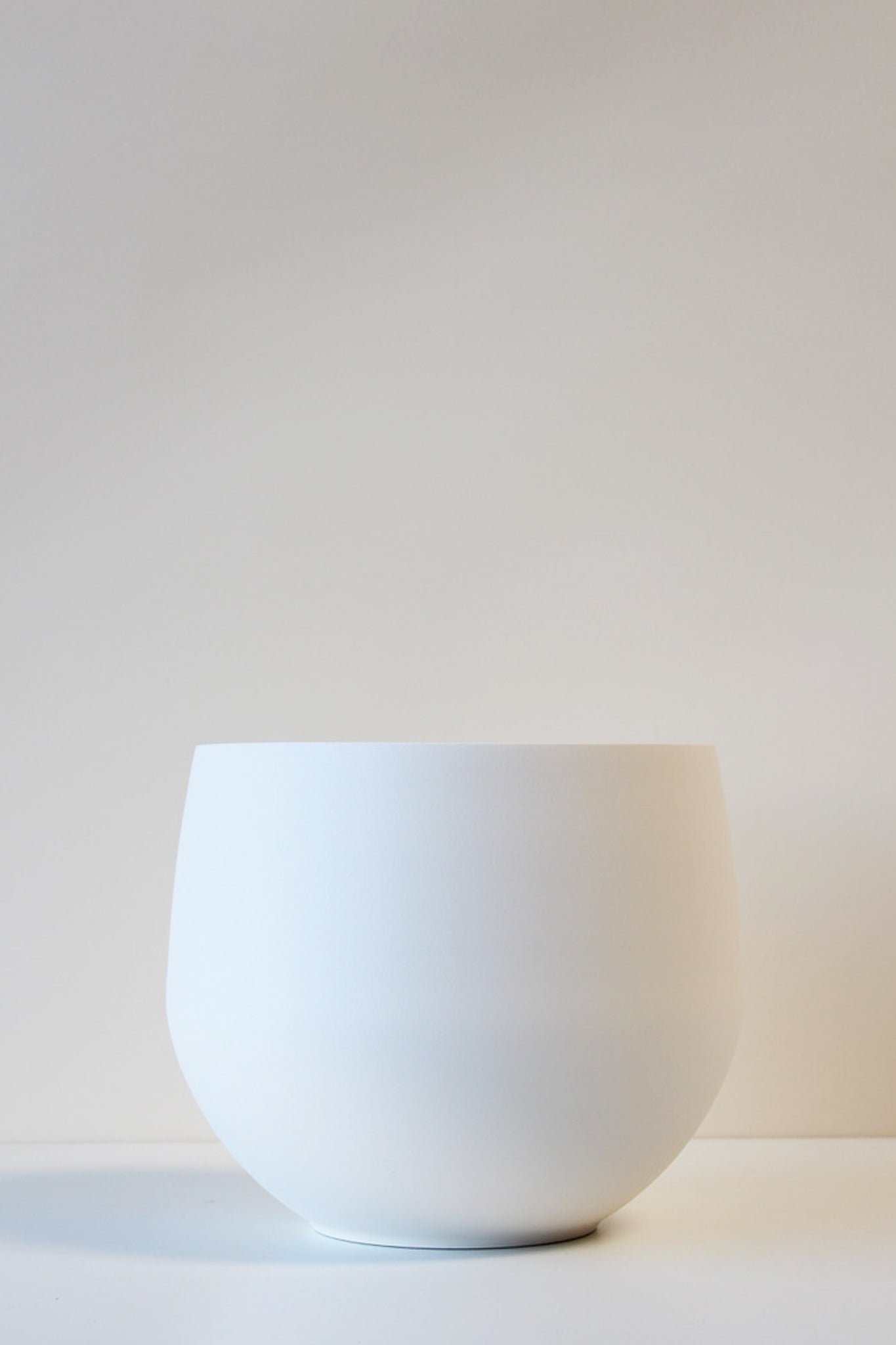 large white spun aluminum pot for plant stand