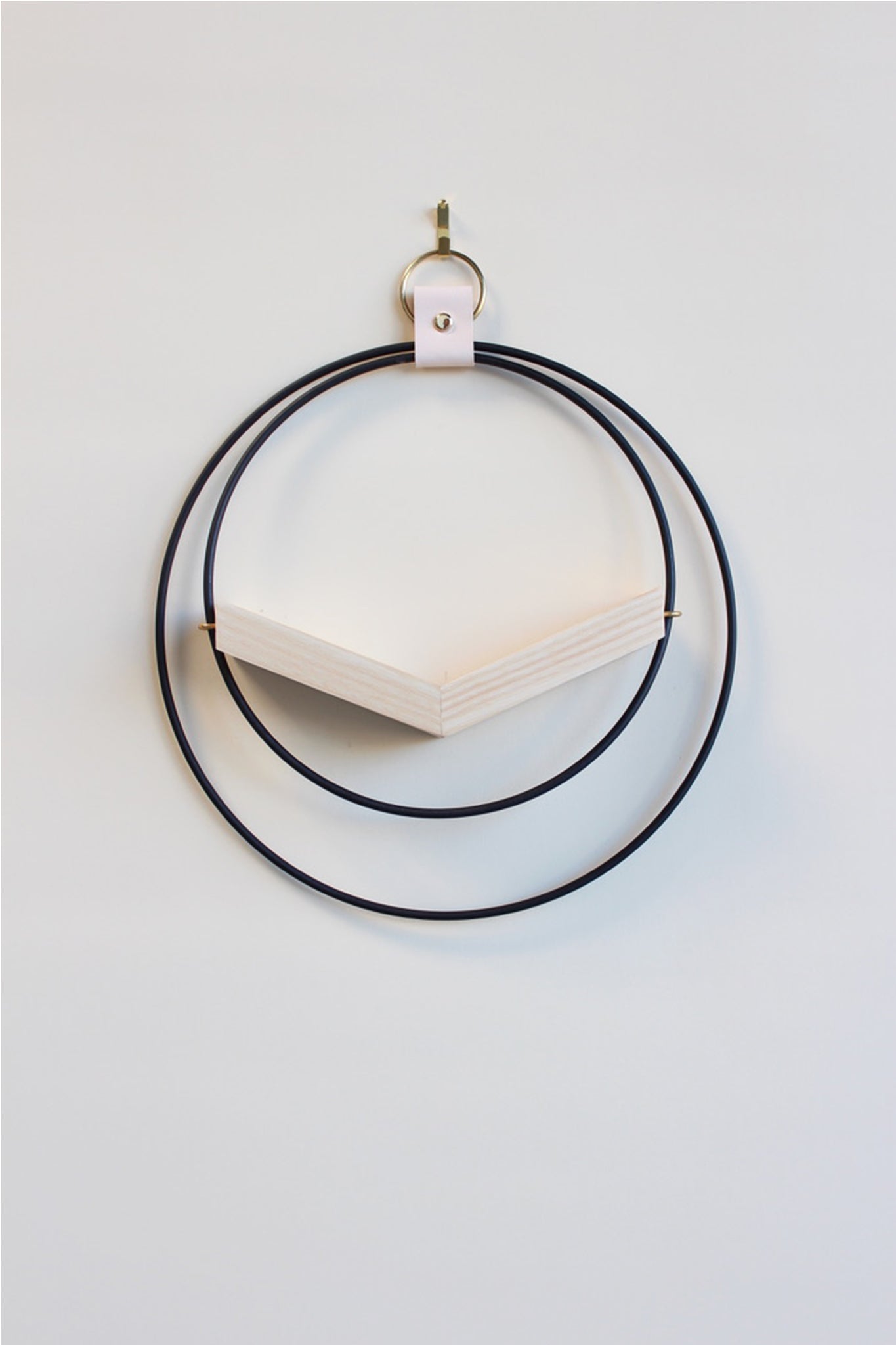 modern wall mounted small v shaped air plant hanger with matte black rings and light wood v shelf