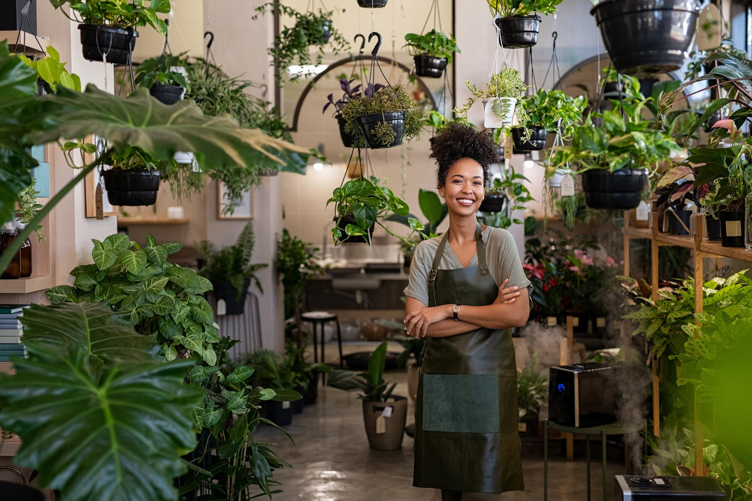 woman standing inside of modern plant shop