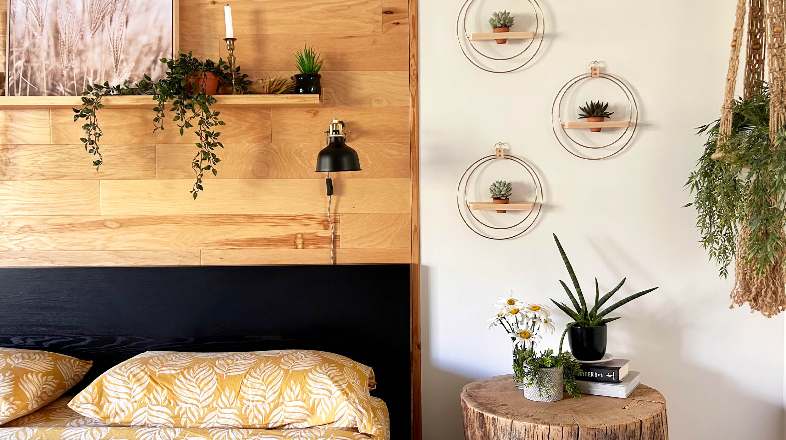 three gold plant shelves with mini terracotta pots by braid & wood hung on wall next to bed