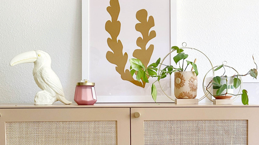 braid & wood gold plant hangers styled on modern storage console