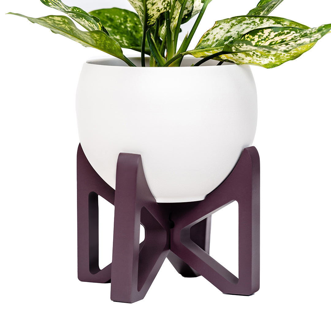 purple wood plant stand with aluminum white pot and houseplant