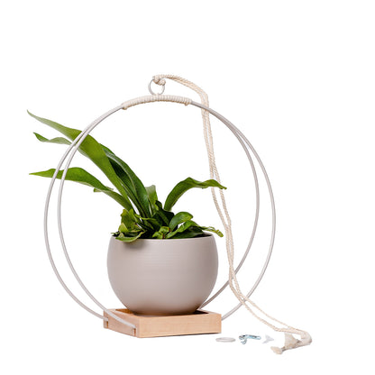 large plant hanger with white metal and maple wood base and tan colored aluminum pot