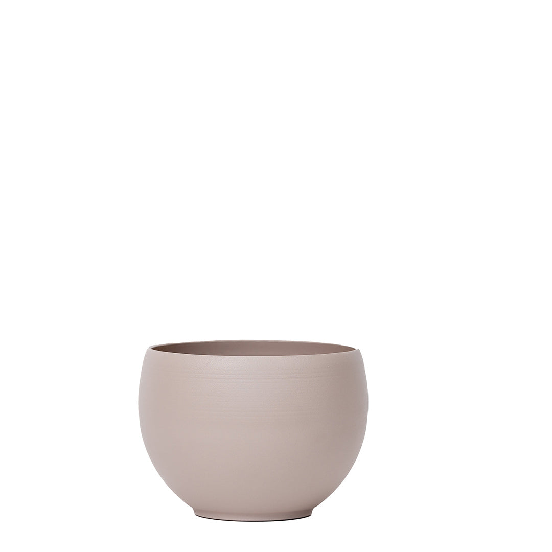 medium aluminum tan colored pot without a plant