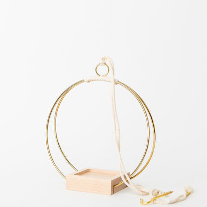 small plant hanger with gold metal and maple wood base and no pot