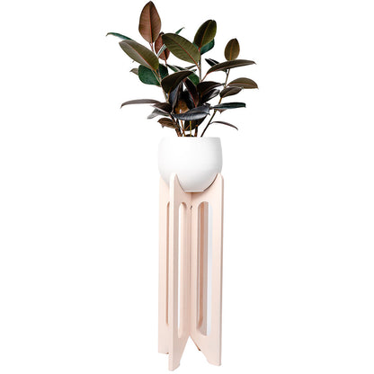 floor standing blush colored wood plant stand with white aluminum pot and rubber tree